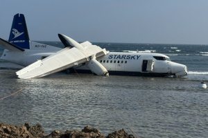 Passenger Plane SLIDES Into Ocean at Mogadishu Airport