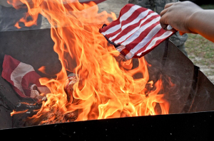 Repeat Offender TORCHES Flag — Hours After Release