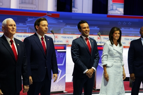 Public figures stand in line at a Fox News event.