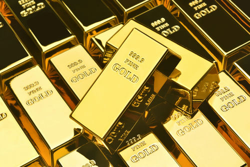 A collection of gold bars stacked together, showcasing their shiny surfaces