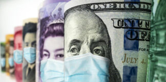 Banknotes with faces of public figures wearing masks.